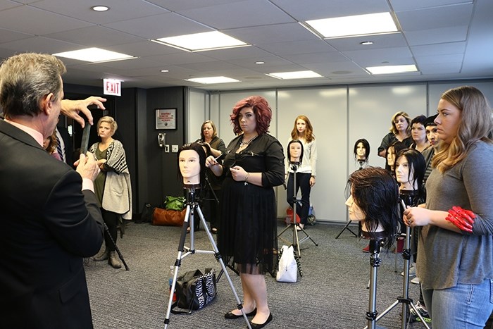 Steve DeCaro from Eufora teaches a cutting class at the Premier Style Show in Chicago.